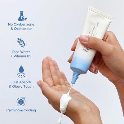 Beauty of Joseon Relief Sun Aqua-Fresh being applied to hand, highlighting rice water, vitamin B5, fast absorption and a calming, cooling finish.